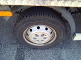 a close up of a flat tire on a truck