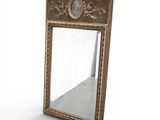 a mirror that is sitting on a white surface