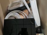 an image of a box with wires and a laptop in it