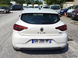 a white car that is parked on the side of the road