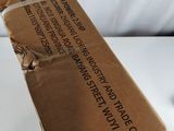 a cardboard airplane that is sitting on a white surface