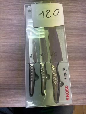 three knives in the package on the table