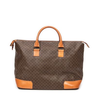 a brown and tan handbag on a white background