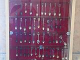 a display case with a lot of spoons and spoons in it