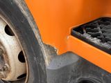 a close up of a truck tire with a grate on it