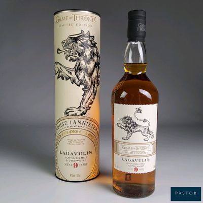 a bottle of game of throne whisky next to a cardboard box