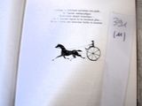 an open book with a drawing of a horse pulling a carriage