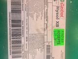 the label on the back of a green trash can has a barcode on it