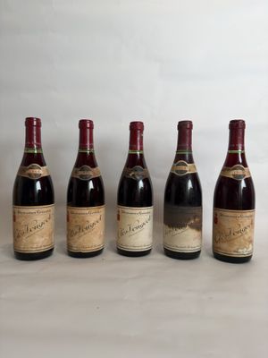 six bottles of wine lined up in a row on a table