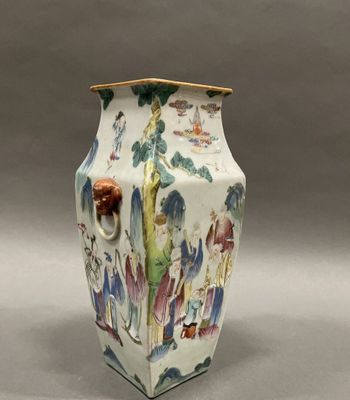 a white vase with a colorful design on it