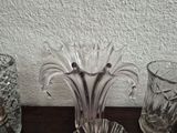 three glass vases on a table next to each other