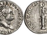 a silver coin with an image of a man holding a sword