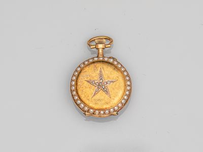 a close up of a gold locke with a star on it