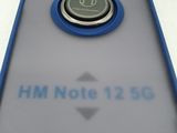 the back of a cell phone with a button on it