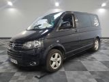 a picture of a black van parked in a garage