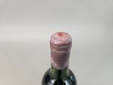 a bottle of wine that is sitting on a table