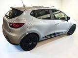 a picture of a silver car parked in a showroom