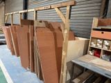 many pieces of wood stacked on top of each other in a warehouse