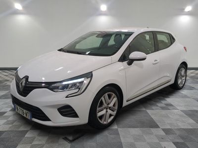 the white car is parked on a checkered tile floor