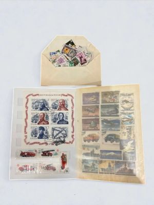 two envelopes with stamps on them sitting on a table