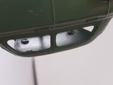 a close up of a car mirror with a dog in it ' s side view mirror