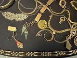 many different types of jewelry on the table