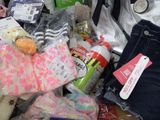 a pile of clothing and other items that are on a table