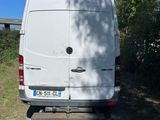 a white van that is parked on the side of the road