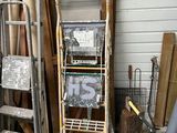 a ladder leaning against a wall next to a pile of wood
