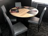 a table with four chairs around it in a room