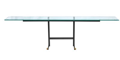 a glass table with metal legs and a glass top
