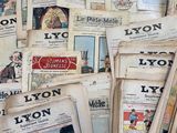 a lot of newspapers that are stacked on top of each other