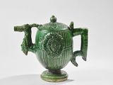 théière en céramique verte avec des anses, sur fond blanc