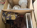 a cardboard box full of items in a room