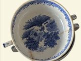 an image of a blue and white bowl with a tree on it