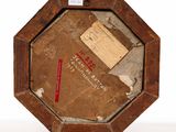 an old picture of a wooden frame with a piece of paper in it