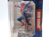 spider - man action figure in a box on a white background