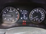 a close up of a car dashboard with a speedometer and gauges