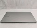 the laptop is sitting on a white surface with a white background