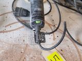 a picture of a sander on a workbench with a price tag