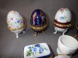 four different types of porcelain eggs on a table