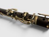 a close up of a bassoon on a white surface