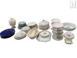 a lot of plates and bowls sitting on a table