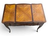 an image of a wooden table with three drawers