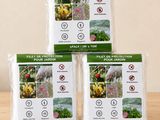 trois sacs d'engrais pour fruits et légumes posés sur une table