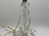 an image of a glass lamp with a rope on top of it