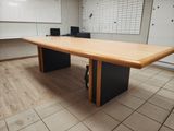a large wooden table in the middle of a room