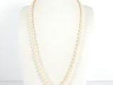 a close up of a necklace on a mannequin mannequin