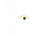 bague en or jaune sertie d'un saphir bleu