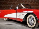 an image of a red and white car parked in front of a brick wall